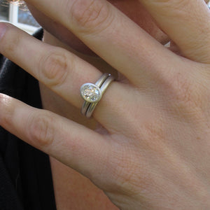 Peekaboo open bezel engagement ring semi-mount with matching rounded wedding band