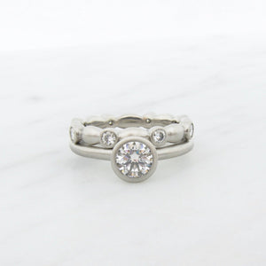 Minimalist wedding band and engagement ring set, low profile bezel set solitaire with stacking bezel set eternity ring