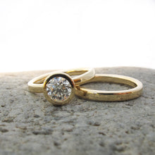 Load image into Gallery viewer, Classic gold and diamond bezel set engagement with gold wedding bands