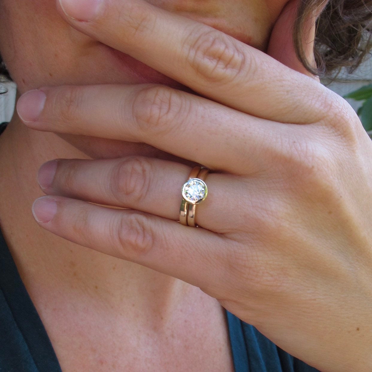 Classic gold and diamond bezel set engagement with gold wedding