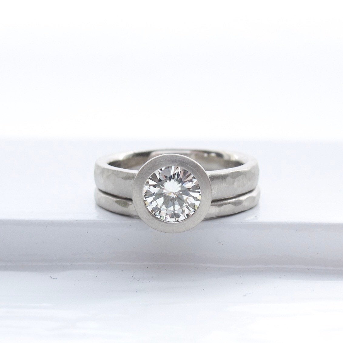 Bezel set solitaire engagement ring semi-mount with narrow hammered wedding band