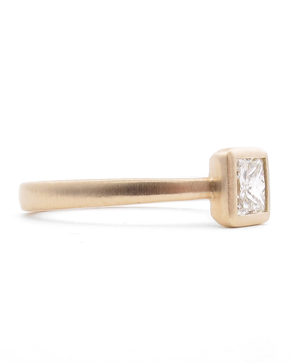 Side view of tapered band diamond engagement ring