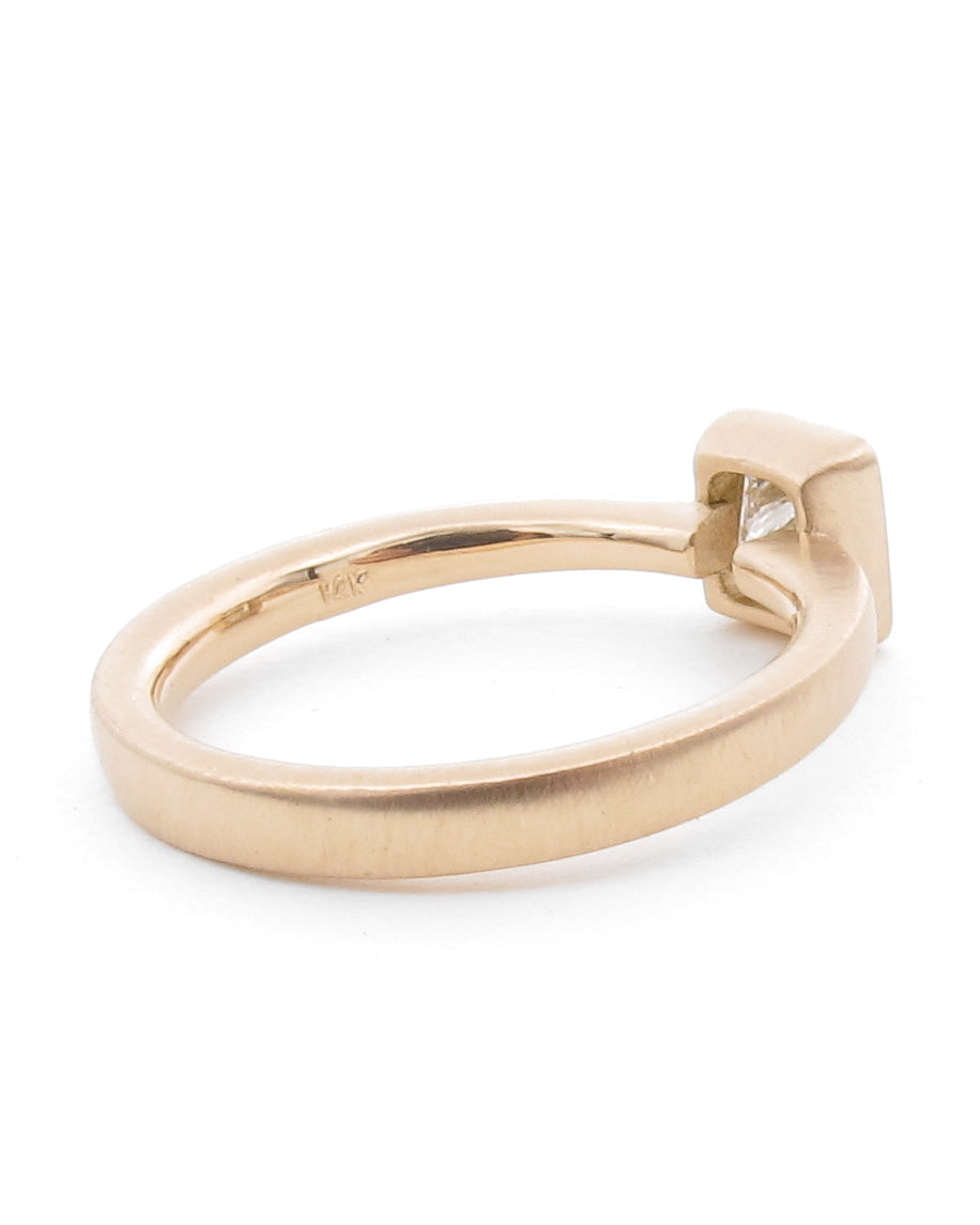 3/4 profile view of diamond bezel engagement ring