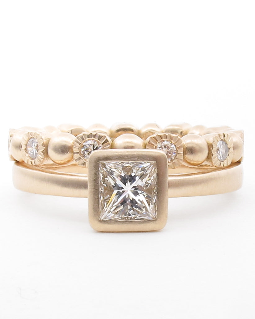 Princess diamond engagement ring in tapered bezel setting