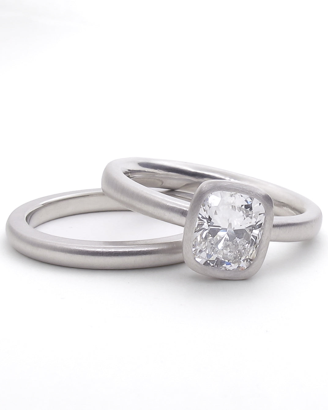 Cushion cut bezel ring with wedding band