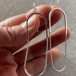 Sterling silver elongated hoop earrings