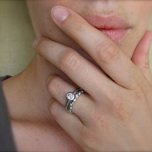 Classic bezel diamond ring with matching platinum and diamond eternity ring