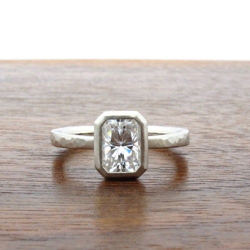 Low profile emerald cut moissanite engagement ring